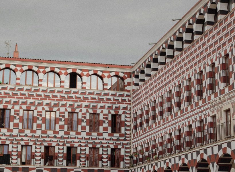 Explore the ornate architecture of an historic courtyard in Badajoz, Spain's old town.
