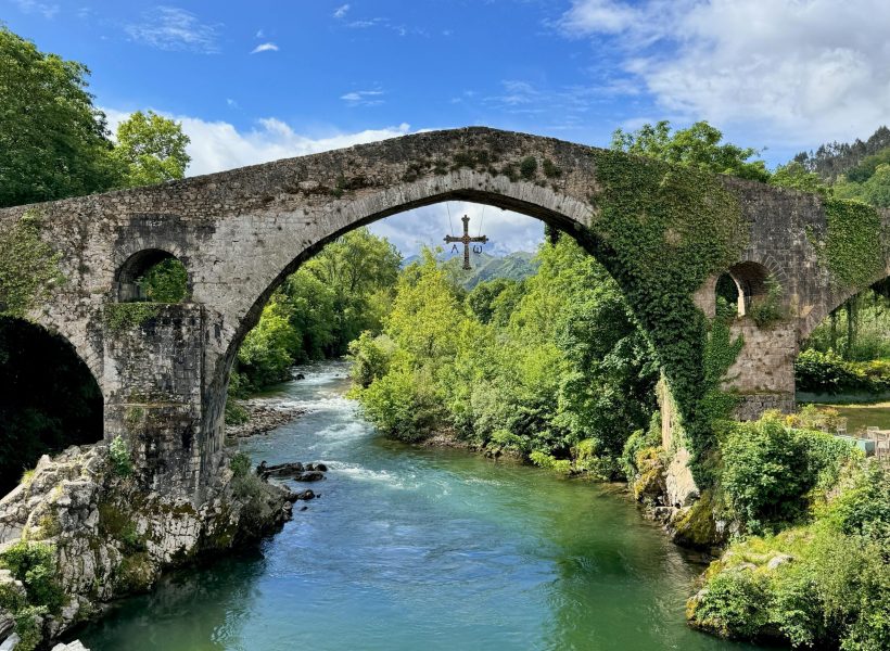 Capture of the ancient Roman Bridge and lush surroundings in Asturias, Spain.